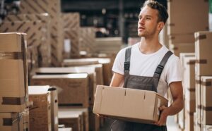 a man holding a box at a fulfillment centre