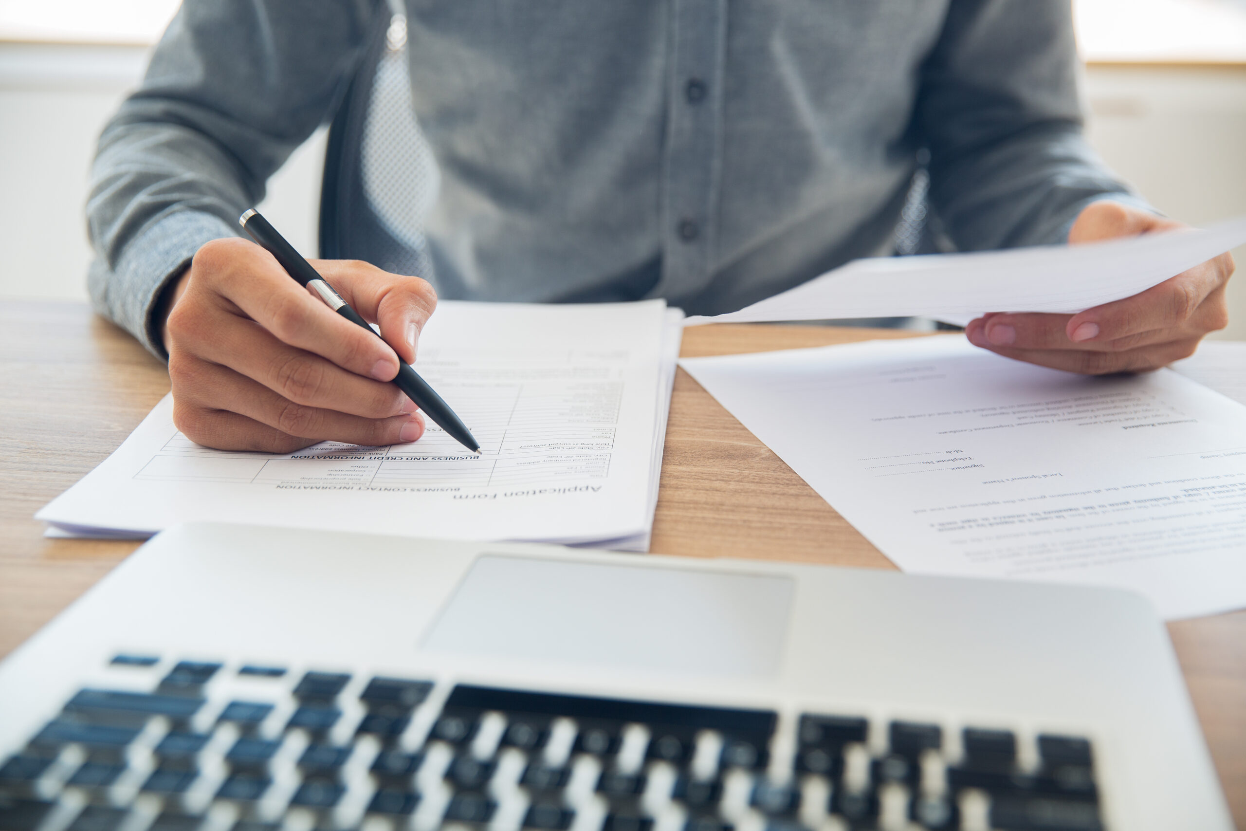 businessman checking documents table scaled