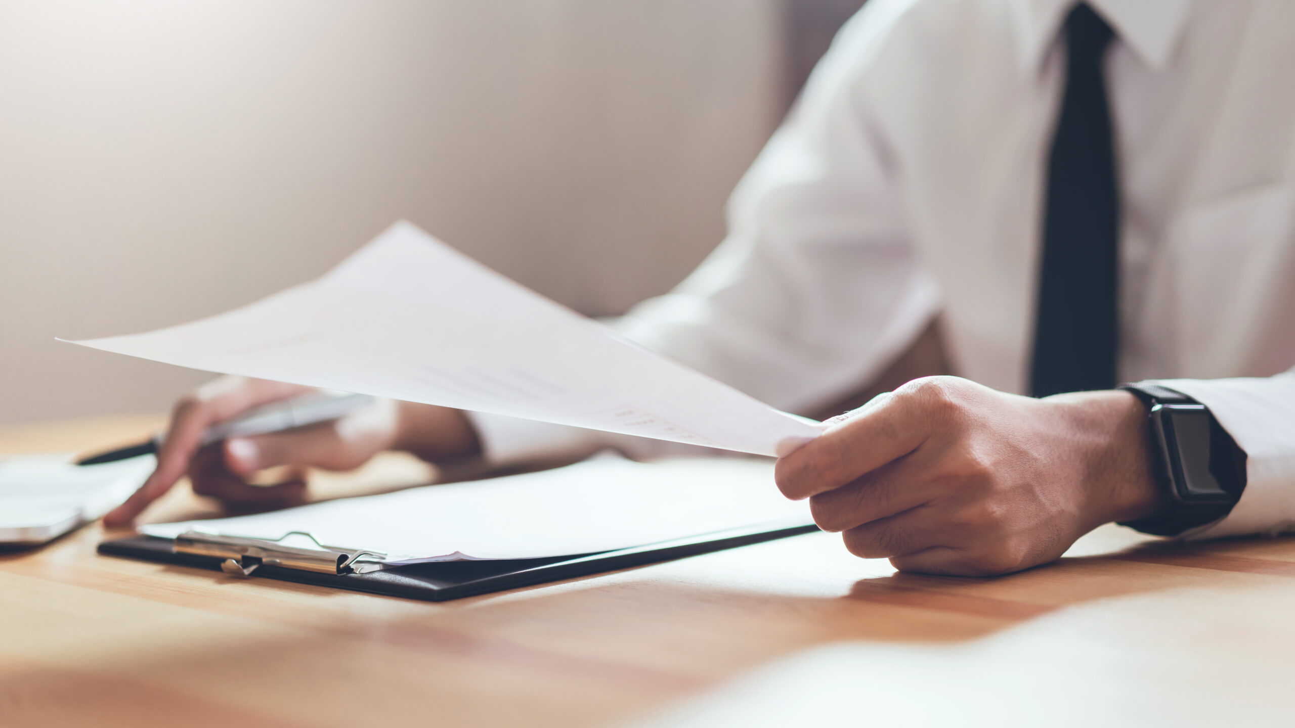 businessman working his office with documents check accuracy information scaled