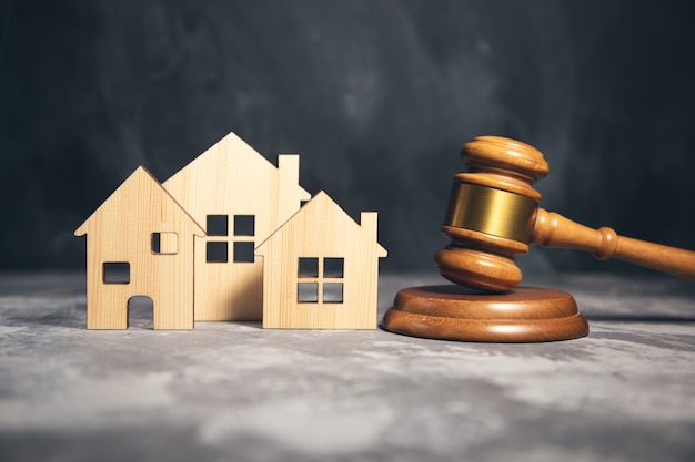 Judge gavel and house model. estate law concept Premium Photo