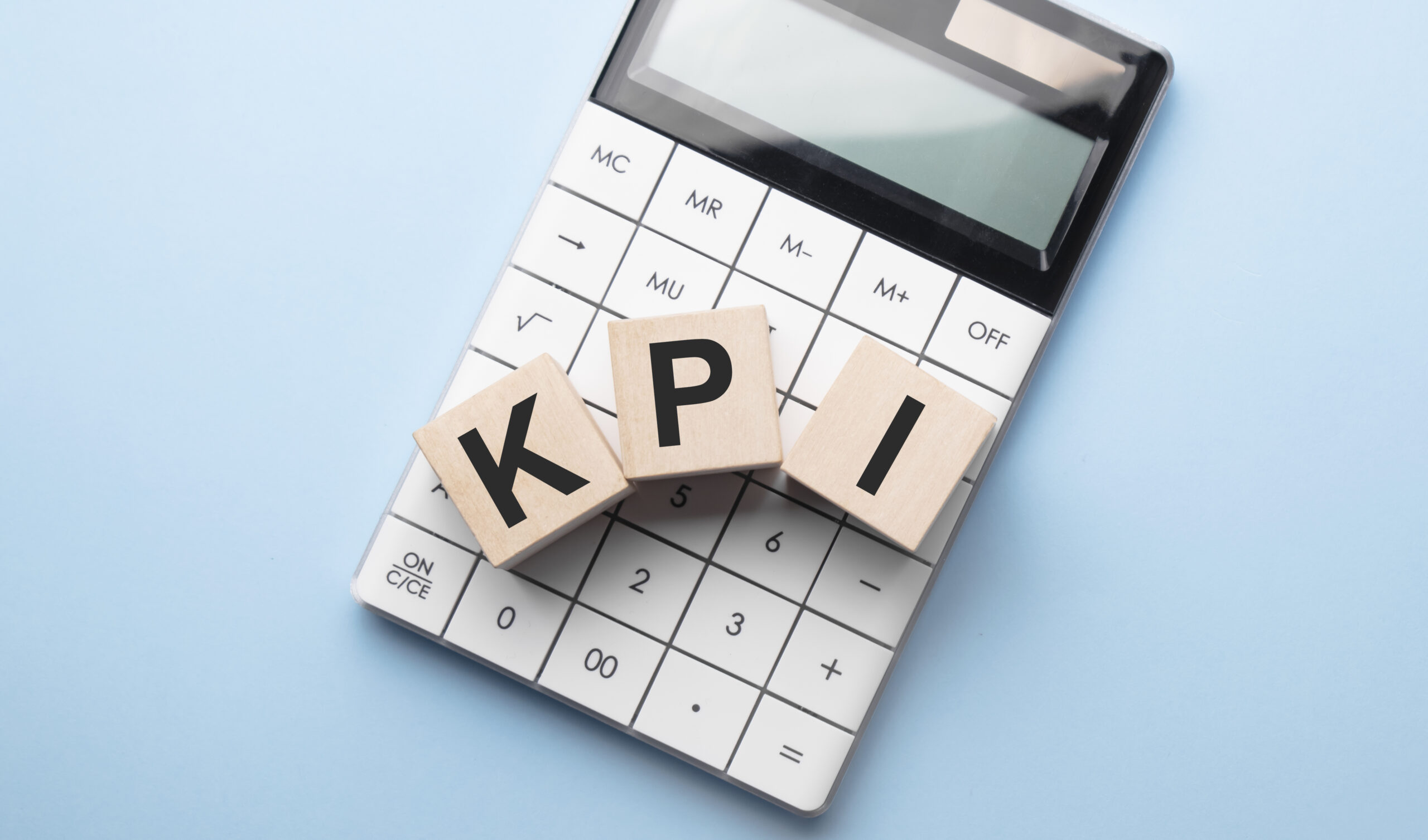 kpi key performance indicator company goal concept cube blocks building word acronym calculator scaled