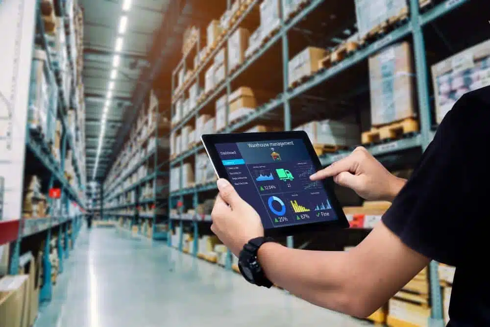 smart warehouse management system worker hands holding tablet blurred warehouse as background1